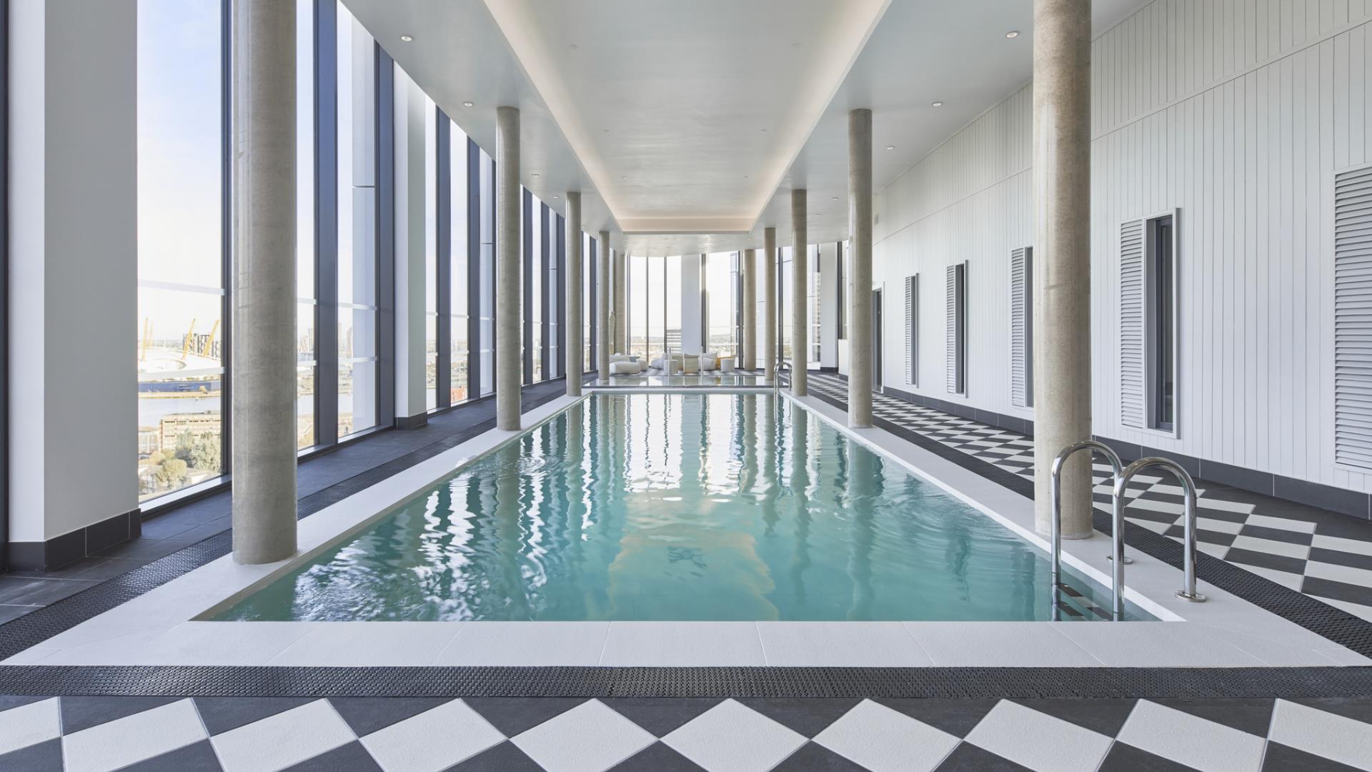 The beautiful pool at The Collective Canary Wharf with views across London.