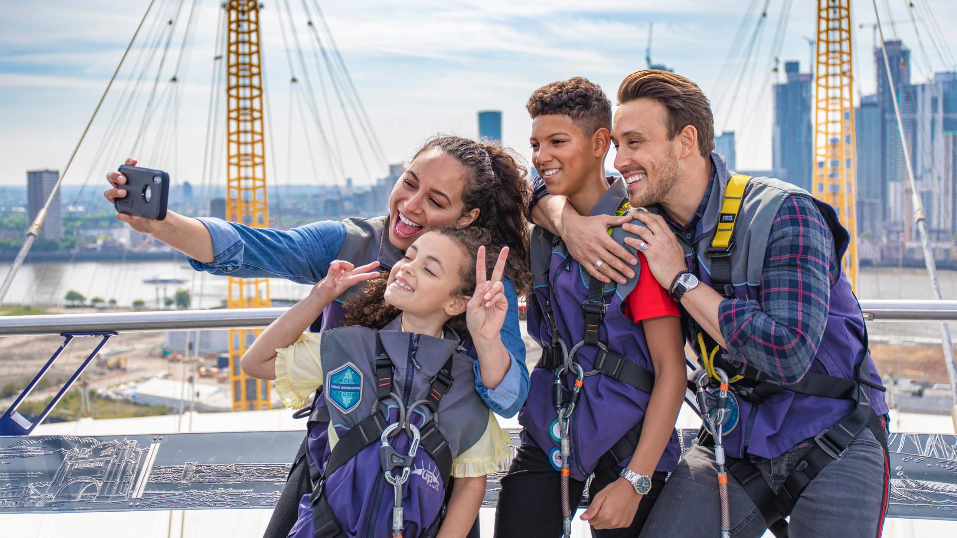 A family take a selfie at Up at The O2 as part of their Greenwich itinerary.