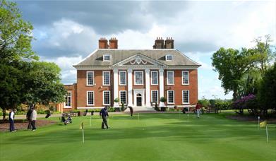 The putting green of Royal Blackheath Golf Club outside the stunning Eltham Lodge.