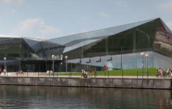An outside picture of The Crystal, a nicely designed building located next to the royal Docks.