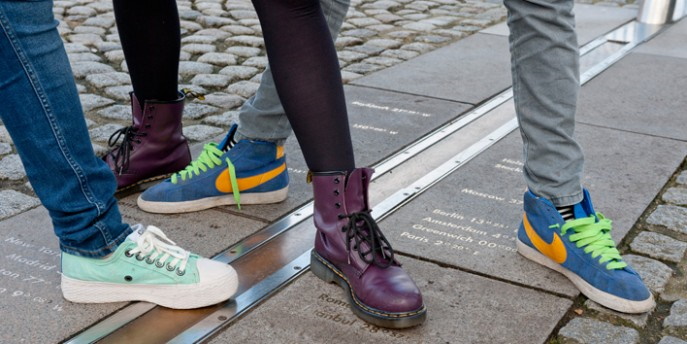 peoples feet on the meridian line in Greenwich