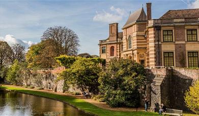 Eltham Palace surrounded by the beautiful gardens and moat