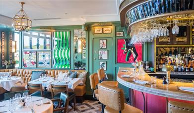 The interior of The Ivy Cafe, Blackheath is decorated with the theme of kites, as the area is well known for its popularity with kite-fliers and kit-s