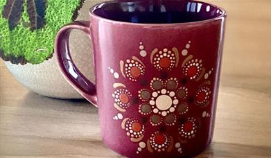 Experience the power of colour and learn how to paint a mandala on a mug