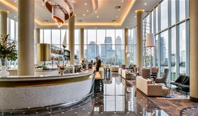 The Clipper Bar at the InterContinental London - The O2. With floor to ceiling windows that overlook the river Thames and Canary Wharf.
