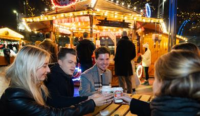 Step into the Winter Carousel and Market Quarter, where classic fairground charm meets the flavours of the festive season