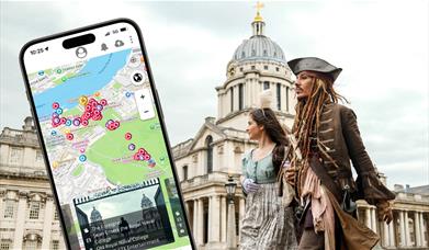 Film characters walk through the Old Royal Naval College. A mobile devide is overlaid showing the SetJetters App.