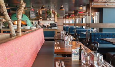 At Zizzi, Greenwich Pier, you can sit and watch as they prepare your food from their open kitchen with pizza oven.