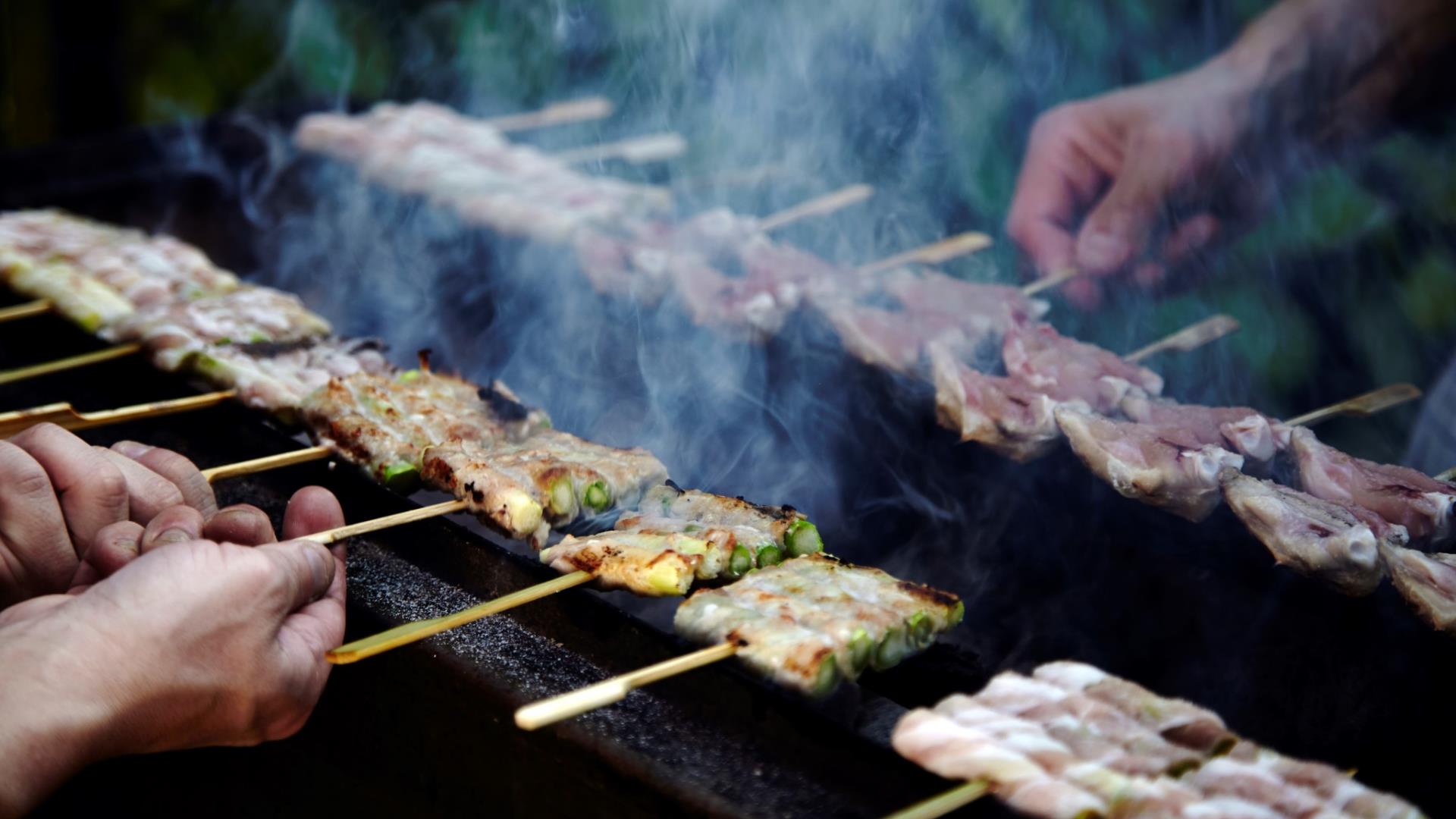 Yakitori sticks being grilled at Sticks n Sushi in Greenwich.