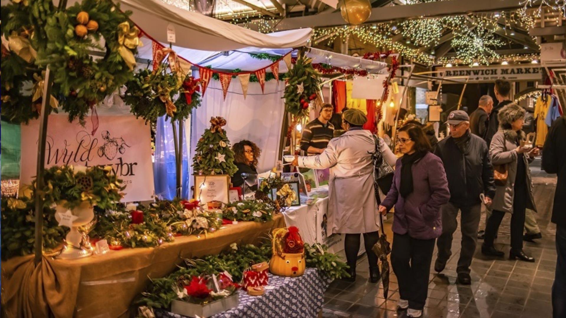 People looking at Christmas stalls at Greenwich Market