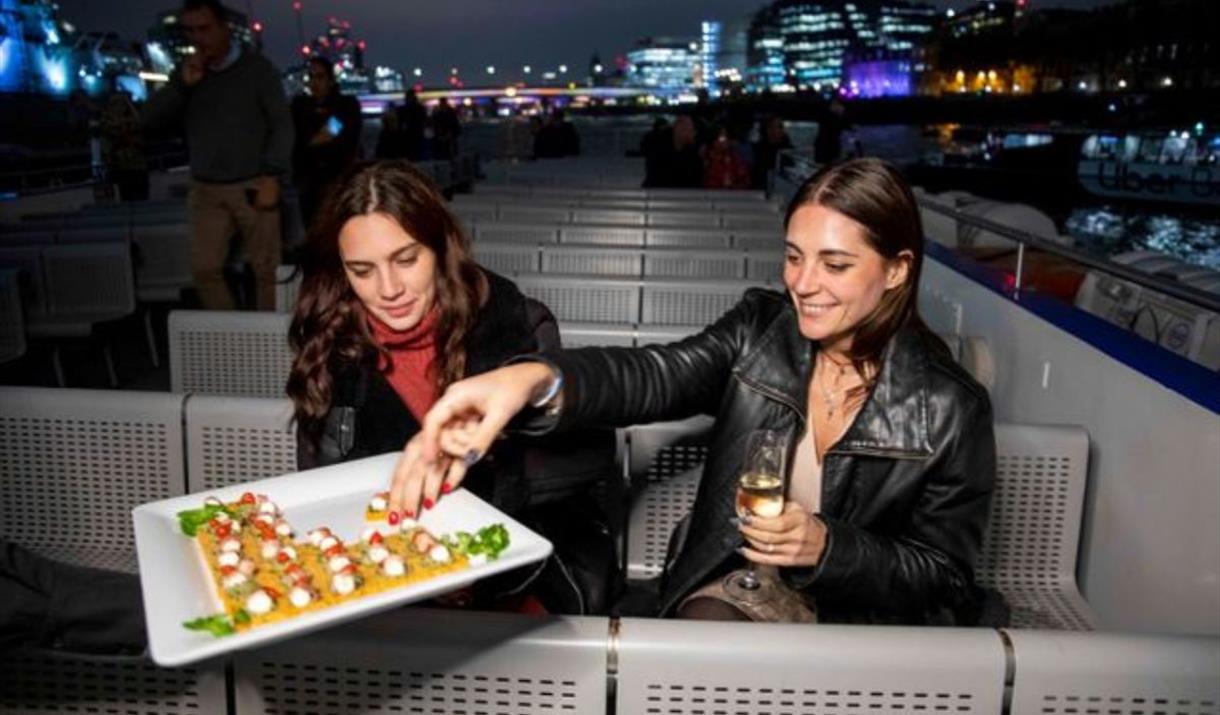 Discover the captivating magic of London's renowned River Thames aboard City Cruises' London Evening Cruise with Canapés & Music