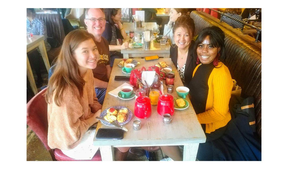 Family and friends enjoying having a nice meal while on the Greenwich Food Tour