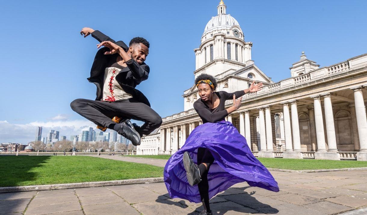 Two artists performing in front of Old Royal Naval College.