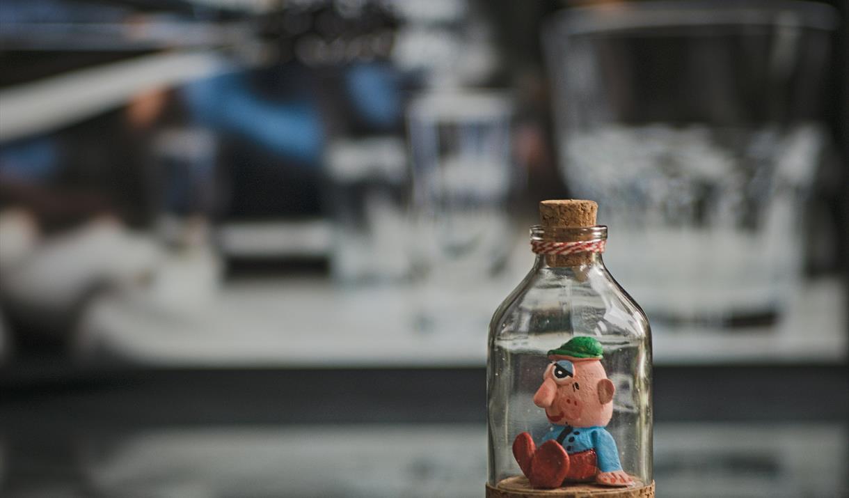 Imagine, you have discovered a tiny ghost trapped inside an old, decorative bottle.