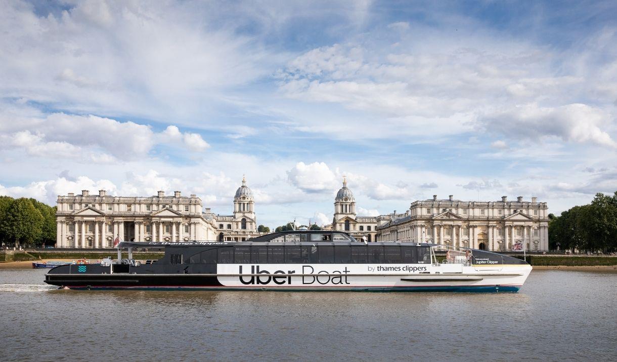 Uber Boat by Thames Clippers sailing on the River Thames overlooking the Old Royal Naval College
