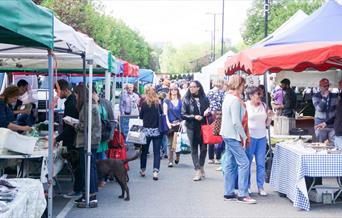 A great picture of Blackheath Market, showing rows of stalls filled with farmers produce.