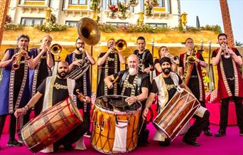Have a go on the dhol drum and learn to play some funky grooves with drummers
