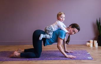 A memorable family yoga class to help new parents bond with their baby in a magnificent setting
