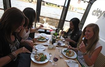 Four ladies enjoying their lunch onboard City Cruises Lunch Cruise.