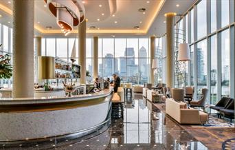 The Clipper Bar at the InterContinental London - The O2. With floor to ceiling windows that overlook the river Thames and Canary Wharf.