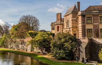 Eltham Palace surrounded by the beautiful gardens and moat.