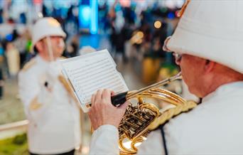 Get in the festive spirit with free musical performances on the iconic golden staircase at the Outlet Shopping at The O2, Greenwich Peninsula