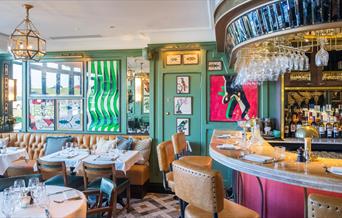 The interior of The Ivy Cafe, Blackheath is decorated with the theme of kites, as the area is well known for its popularity with kite-fliers and kit-s