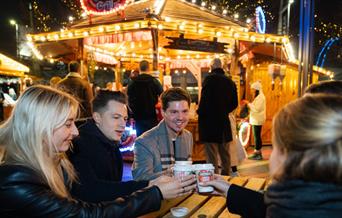 Step into the Winter Carousel and Market Quarter, where classic fairground charm meets the flavours of the festive season