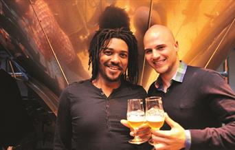 Two guys enjoy a sample of beer on a Meantime Brewery Tour in Greenwich.