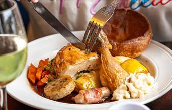 This Mother's Day, gather your loved ones and indulge in a quintessential Sunday roast at the Trafalgar Tavern