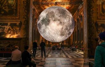 Luke Jerram’s awe-inspiring Museum of the Moon is displayed in the magnificent Painted Hall 