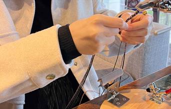 Discover the art of traditional Chinese knotting while cultivating mindfulness and inner calm