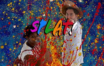 A female and male artist splattering paint from paint brushes towards their audience