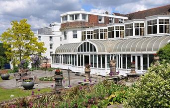 Image shows the grounds and entrance of The Bromley Court Hotel