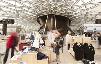 Inside The Cutty Sark Gift Shop, showing a wide range in souvenirs spread across the ground floor.