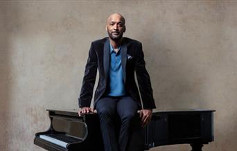 A 19-piece NYJO band joined by national treasure Tommy Blaize to perform the unforgettable songs of Ray Charles