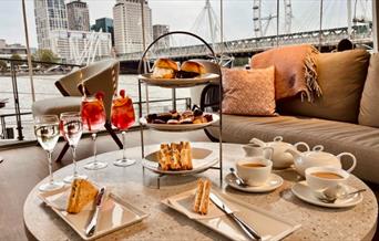 An elegant Afternoon Tea experience on the Thames at Clipper Lounge EMB, London’s riverside café bar on Embankment Pier