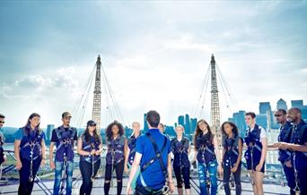 Group of people stood on the roof of The O2 at Up at The O2 overlooking Canary Wharf
