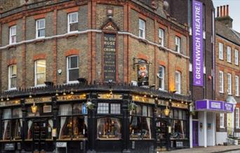 Exterior image of Ye Olde Rose and Crown pub with black window frames. The pub has Greenwich Theatre right next to it.