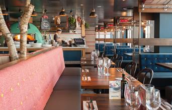 At Zizzi, Greenwich Pier, you can sit and watch as they prepare your food from their open kitchen with pizza oven.