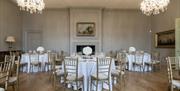 White banqueting rounds on wooden floor at the Admiral's House, Old Royal Naval College