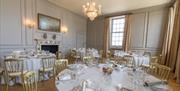White banqueting rounds on wooden floor at the Admiral's House, Old Royal Naval College