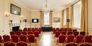 Red chairs in theatre layout at the Admiral's House, Old Royal Naval College