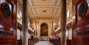 Brown doors and columns of the entrance to the Chapel, Old Royal Naval College