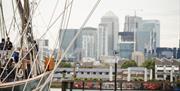 Cutty Sark overlooking the River Thames and buildings in Canary Wharf