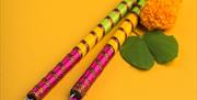 Create your own decorated sticks using tassels, threads and reflective tape