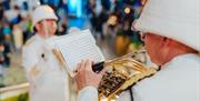 Get in the festive spirit with free musical performances on the iconic golden staircase at the Outlet Shopping at The O2, Greenwich Peninsula