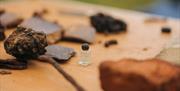 Uncover buried artefacts using the tools of an archaeologist!