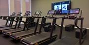 Image of the gym area with threadmills at the Woolwich Waves Leisure Centre in Woolwich