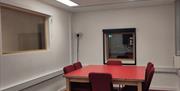 Meeting Room, can accommodate up to 6 people.